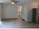 Dining area with laminate floors and access to kitchen and hallway at 1650 Bridgeport Nw Dr, Atlanta, GA 30318