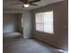 Bright living room with vinyl flooring and ceiling fan at 1650 Bridgeport Nw Dr, Atlanta, GA 30318