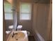 Clean bathroom featuring a tub, toilet, sink, and vanity at 1650 Bridgeport Nw Dr, Atlanta, GA 30318