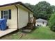 Back exterior view of the house with wooden steps and yard at 1650 Bridgeport Nw Dr, Atlanta, GA 30318