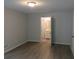 Spacious bedroom with vinyl flooring and access to bathroom at 1650 Bridgeport Nw Dr, Atlanta, GA 30318