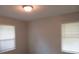 Well-lit bedroom with two windows and vinyl flooring at 1650 Bridgeport Nw Dr, Atlanta, GA 30318