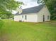 Yellow house with large backyard at 15 Marissa Cv, Riverdale, GA 30274