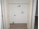 Simple laundry room with washer and dryer hookups, shelving and vinyl flooring at 15 Marissa Cv, Riverdale, GA 30274
