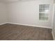 Spacious bedroom with hardwood floors and neutral wall colors at 15 Marissa Cv, Riverdale, GA 30274