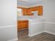Galley kitchen with wood cabinets and white appliances at 15 Marissa Cv, Riverdale, GA 30274