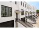 Side view of townhouses with white brick and black accents at 3667 Peachtree Ne Rd # 10, Atlanta, GA 30319