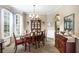 Formal dining room with hardwood floors, a large window, and a chandelier at 209 Vine Creek Drive, Acworth, GA 30101