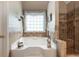 Relaxing bathroom with a large soaking tub and separate shower at 209 Vine Creek Drive, Acworth, GA 30101