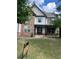 Two-story house with stone and vinyl siding, landscaping, and a large front yard at 190 Thrushwood Dr, Fayetteville, GA 30215