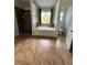 Main bathroom with a soaking tub, shower, and tile floors at 190 Thrushwood Dr, Fayetteville, GA 30215