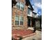 Stone and vinyl sided two-story house with a walkway and landscaping at 190 Thrushwood Dr, Fayetteville, GA 30215