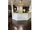 Open kitchen with breakfast bar, granite countertops, and dark cabinets at 190 Thrushwood Dr, Fayetteville, GA 30215