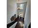 Two-story foyer with dark hardwood floors, chandelier, and staircase at 190 Thrushwood Dr, Fayetteville, GA 30215