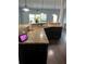 Kitchen with granite countertops, dark cabinets, and an island at 190 Thrushwood Dr, Fayetteville, GA 30215