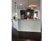 Kitchen with breakfast bar, granite countertops, and dark cabinets at 190 Thrushwood Dr, Fayetteville, GA 30215