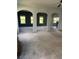 Open living room with grey carpet and views into other rooms at 190 Thrushwood Dr, Fayetteville, GA 30215