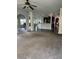Open living area with grey carpet, and views of kitchen and dining areas at 190 Thrushwood Dr, Fayetteville, GA 30215