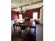 Spacious dining room with dark hardwood floors and a lovely chandelier at 190 Thrushwood Dr, Fayetteville, GA 30215