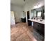 Large bathroom with double vanities and tile flooring at 190 Thrushwood Dr, Fayetteville, GA 30215