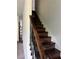 Dark wood staircase with wrought iron railing at 190 Thrushwood Dr, Fayetteville, GA 30215
