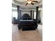 Large main bedroom with dark wood canopy bed and carpeted floor at 190 Thrushwood Dr, Fayetteville, GA 30215
