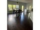 Spacious dining room with dark hardwood floors and a view to backyard at 190 Thrushwood Dr, Fayetteville, GA 30215