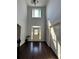 Two-story foyer with dark hardwood floors, and a view of the staircase at 190 Thrushwood Dr, Fayetteville, GA 30215