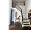 Elegant staircase with dark wood and wrought iron railing at 190 Thrushwood Dr, Fayetteville, GA 30215