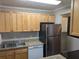 Updated kitchen features granite countertops, stainless steel appliances, and light wood cabinets at 2396 Lawrenceville Hwy # F, Decatur, GA 30033