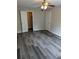Spacious bedroom with ceiling fan and gray vinyl flooring at 2396 Lawrenceville Hwy # F, Decatur, GA 30033