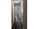 Bright hallway with gray vinyl flooring and access to bedrooms at 2396 Lawrenceville Hwy # F, Decatur, GA 30033