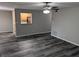 Open living room with wood-look floors and kitchen pass-through at 2396 Lawrenceville Hwy # F, Decatur, GA 30033