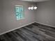 Bright dining room with wood-look floors and a chandelier at 2396 Lawrenceville Hwy # F, Decatur, GA 30033