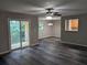 Spacious living room with wood-look floors, access to balcony and kitchen at 2396 Lawrenceville Hwy # F, Decatur, GA 30033