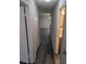 Light-filled hallway with wood-look floors, leading to bedrooms and bathroom at 2396 Lawrenceville Hwy # F, Decatur, GA 30033