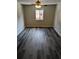 Bedroom with ceiling fan and gray vinyl flooring, and a window at 2396 Lawrenceville Hwy # F, Decatur, GA 30033