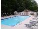 Community pool with plenty of lounge chairs at 2396 Lawrenceville Hwy # F, Decatur, GA 30033