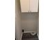White cabinets and gray vinyl flooring in this laundry closet at 2396 Lawrenceville Hwy # F, Decatur, GA 30033