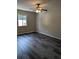 Bedroom with ceiling fan and gray vinyl flooring, and a window at 2396 Lawrenceville Hwy # F, Decatur, GA 30033