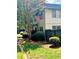 Building exterior showcasing landscaping and fence at 307 Lakemoore Ne Dr # D, Atlanta, GA 30342