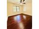Spacious bedroom with hardwood floors and large windows at 307 Lakemoore Ne Dr # D, Atlanta, GA 30342