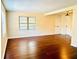 Bright living room featuring hardwood floors and large windows at 307 Lakemoore Ne Dr # D, Atlanta, GA 30342