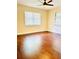 Well-lit bedroom with hardwood floors and ceiling fan at 307 Lakemoore Ne Dr # D, Atlanta, GA 30342