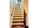 Elegant wooden staircase leading to upper level at 307 Lakemoore Ne Dr # D, Atlanta, GA 30342