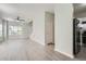 Living area with gray walls, hardwood floors, and kitchen access at 2259 Sisk Nw St, Atlanta, GA 30318