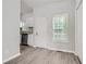 Simple dining area with wood-look floors and white door at 2259 Sisk Nw St, Atlanta, GA 30318