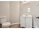 Clean bathroom with white vanity, toilet, and mirror at 2259 Sisk Nw St, Atlanta, GA 30318