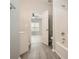 Bathroom with a bathtub, vinyl flooring, and access to bedroom at 2259 Sisk Nw St, Atlanta, GA 30318