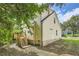 Two-story house with wooden deck and landscaped yard at 2259 Sisk Nw St, Atlanta, GA 30318